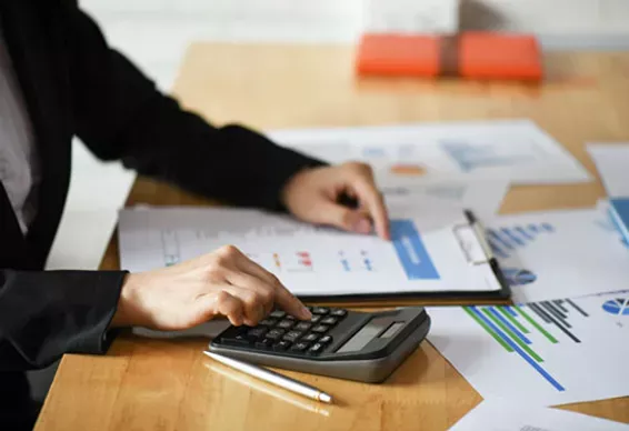 cropped shot of accounting staff are using calculators and graphing to pay annual taxes 2 - Paradigm Shift LLC